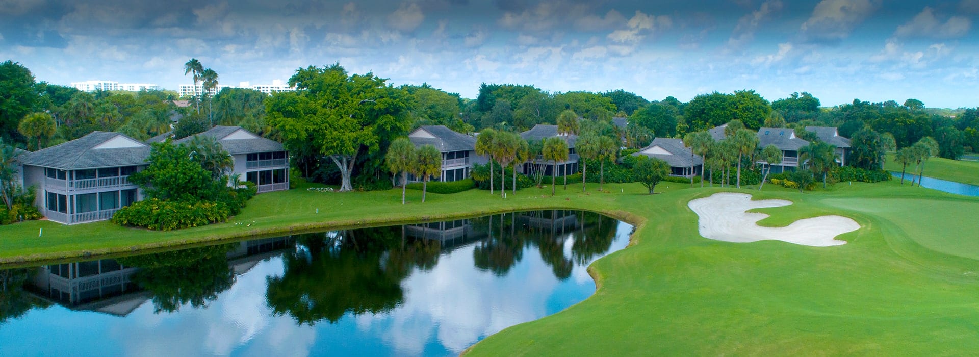 Plantation Colony attached villas nestled in among large trees and alongside the golf course