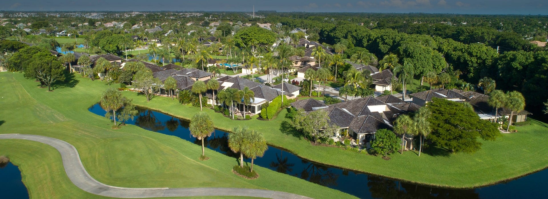 Boca West Waters Reach neighborhood alongside large lake and golf course