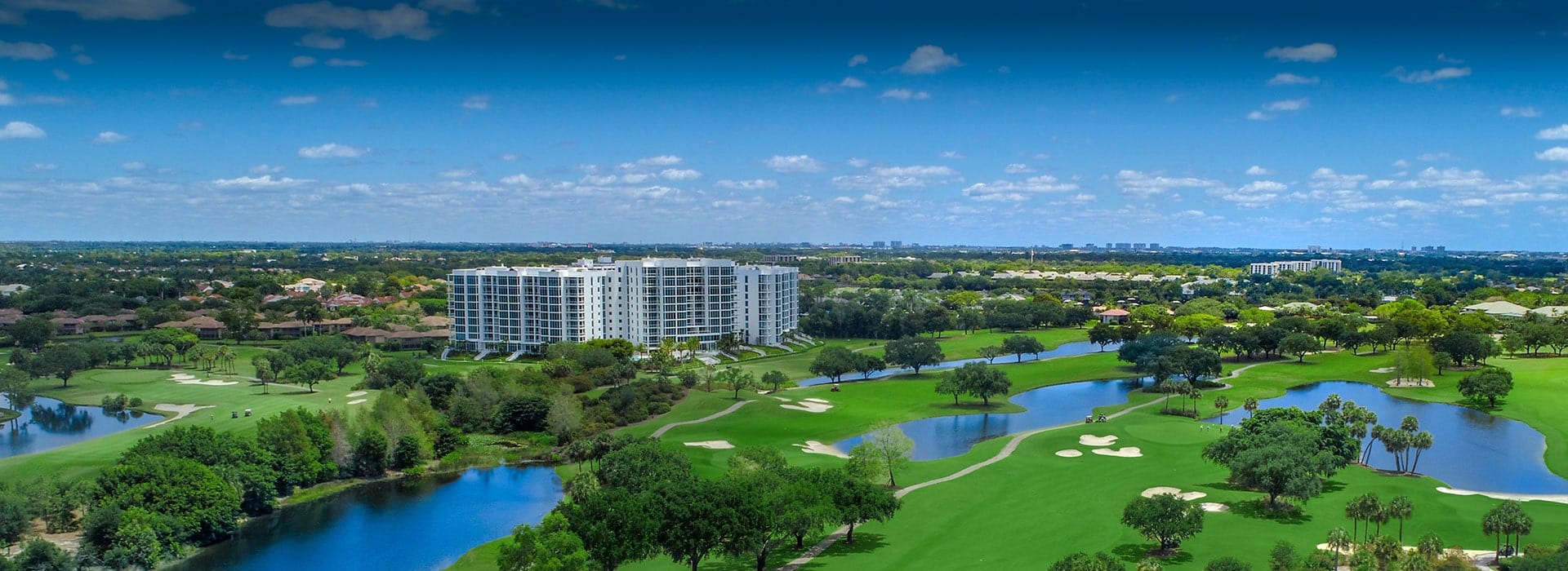 Boca West Golf Course with Akoya condominium building