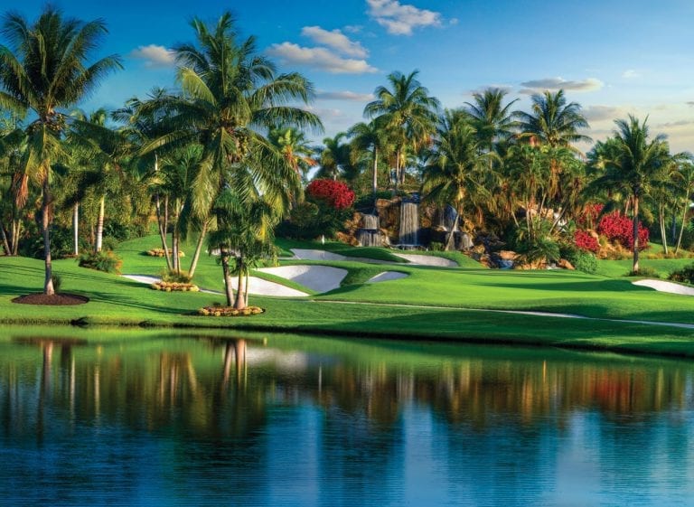 Group of bunkers and waterfall on Boca West's Fazio II golf course hole 18