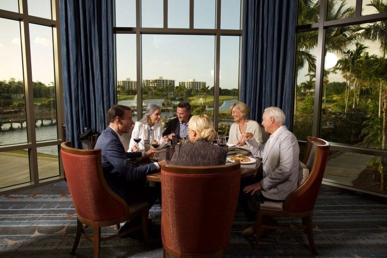 Table of couples dining at Boca West's Prime Cut