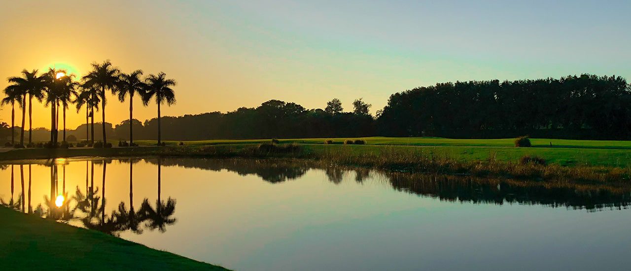 lake in boca west at sunset
