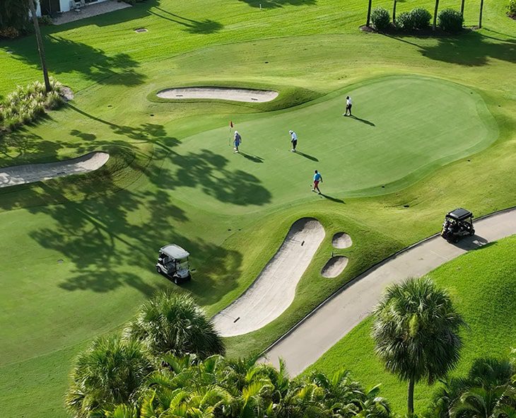 aerial of golfers on boca west championship golf courses