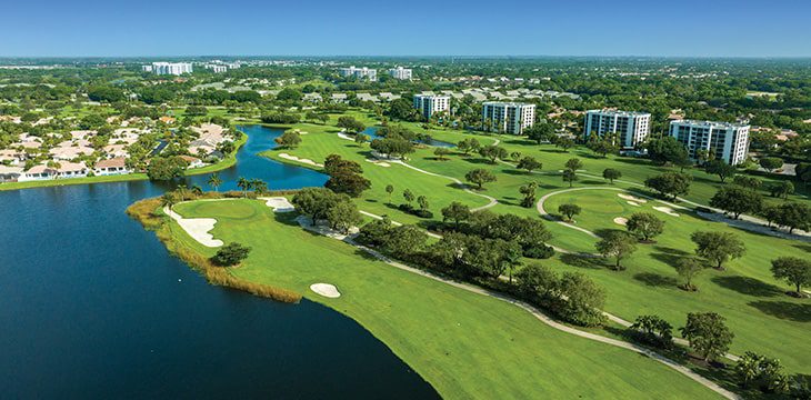 aerial with homes, golf course and lakes