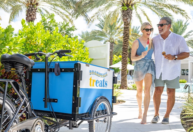 poolside treats couple walking with ice cream