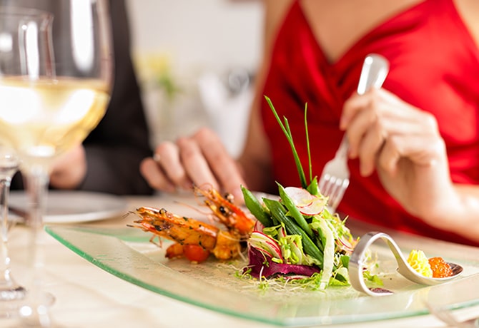 WOman eating plate of food